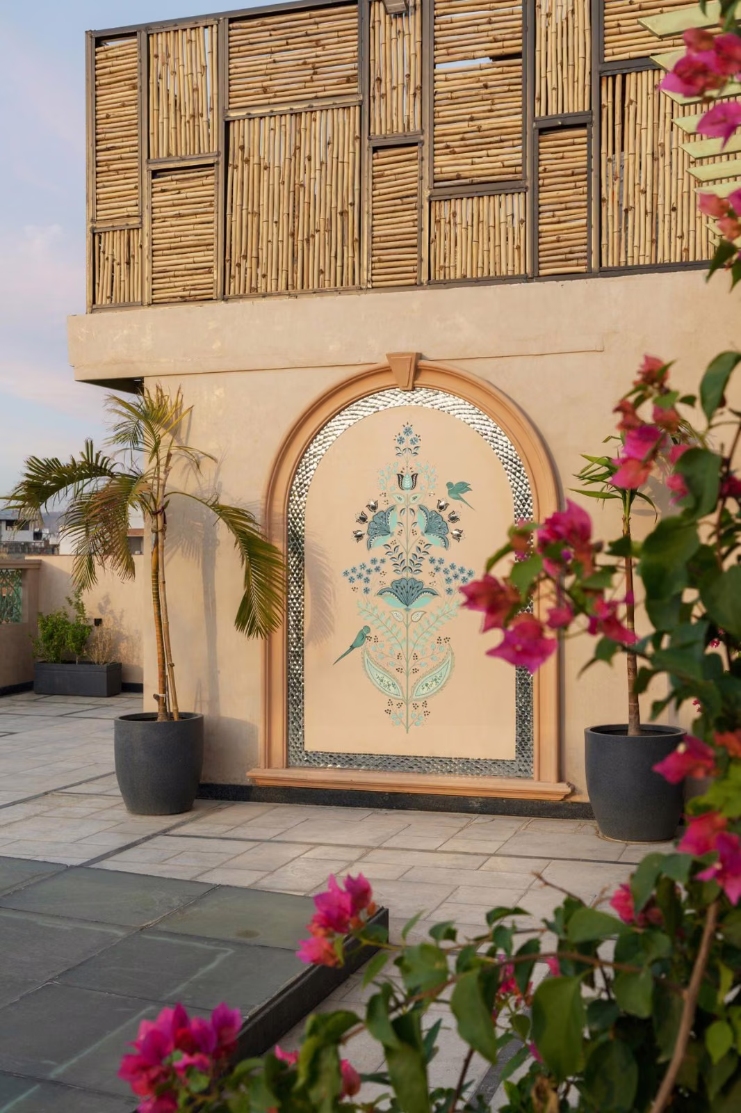 Landscaped courtyard with decorative arch and planting