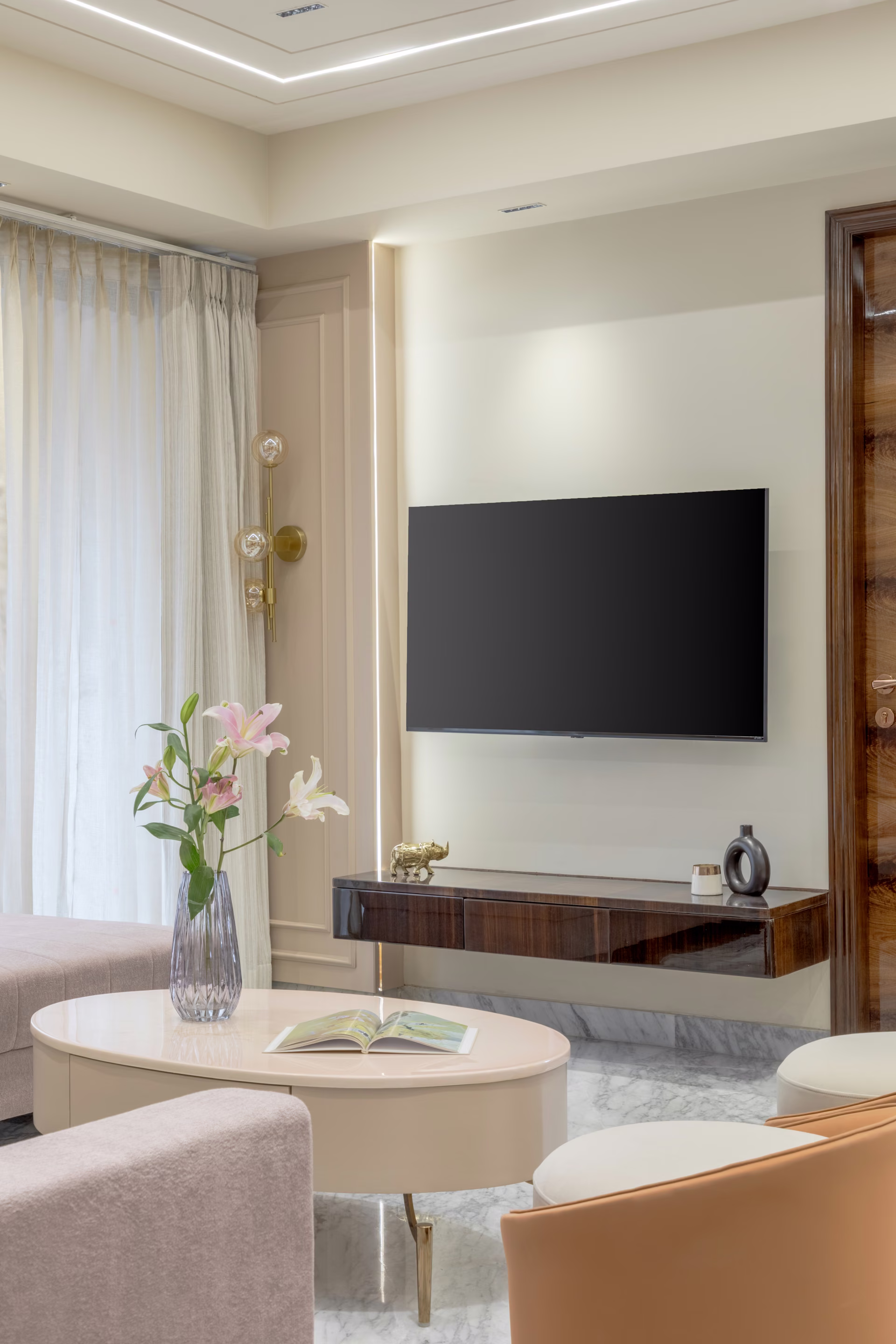 Elegant living space with warm neutral palette and bespoke joinery