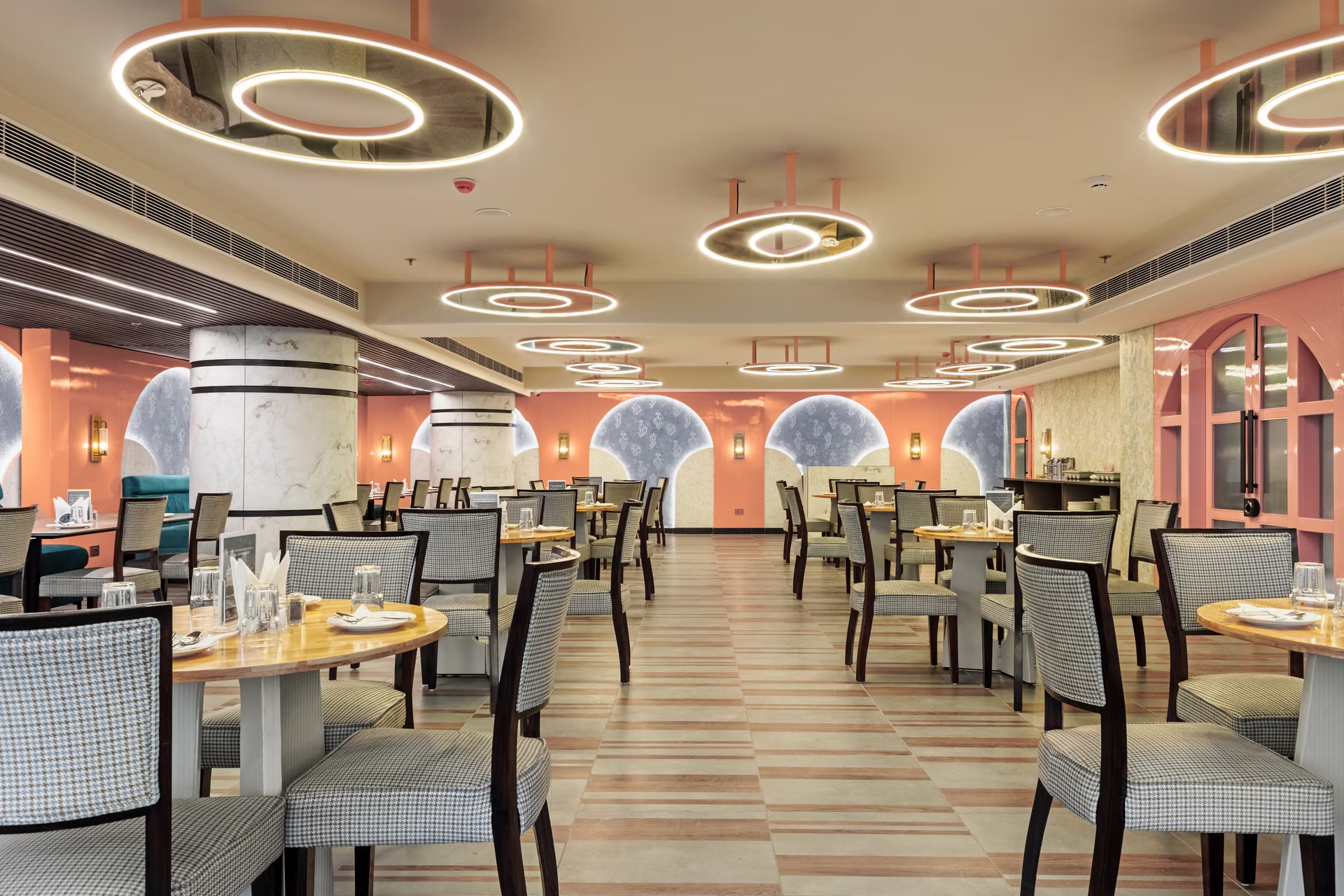 Warm, layered restaurant dining room with considered lighting